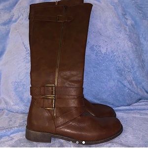 Super cute brown knee high boots.